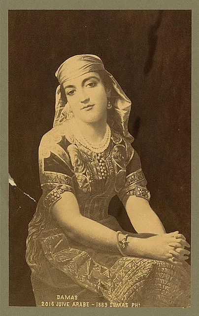 Studio portrait of models wearing traditional clothing from the province of Surı, 1873